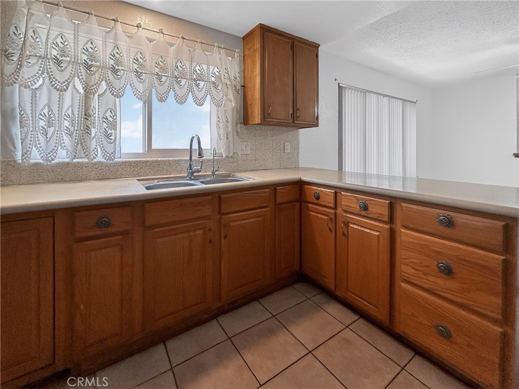 7451 Diamond Street Riverside, CA 92504 - Photo 5 of 31 a kitchen with sink and cabinets