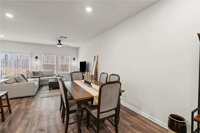a view of a livingroom with furniture and wooden floor