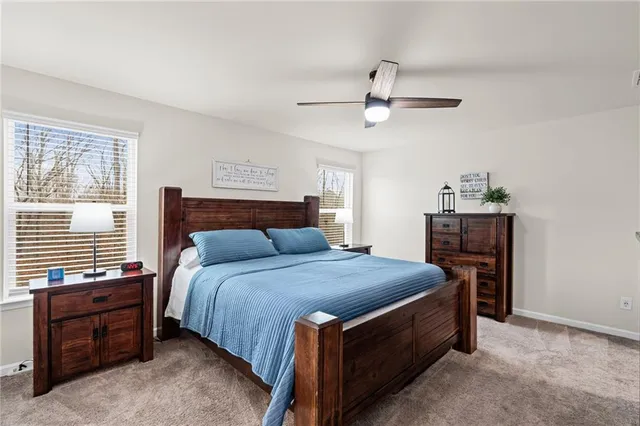 a bedroom with a bed and furniture