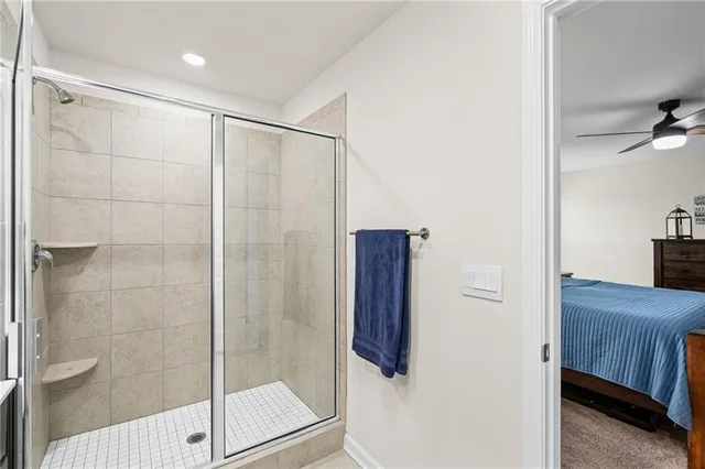 a bathroom with a shower and a sink