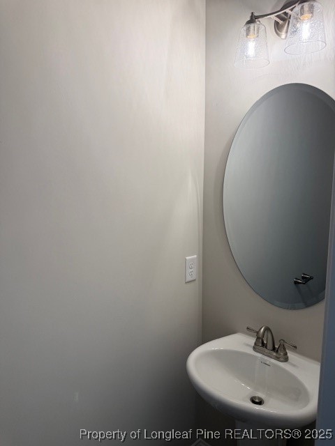 112 Surles Road Benson, NC 27504 - Photo 13 of 40 a bathroom with a sink and a mirror