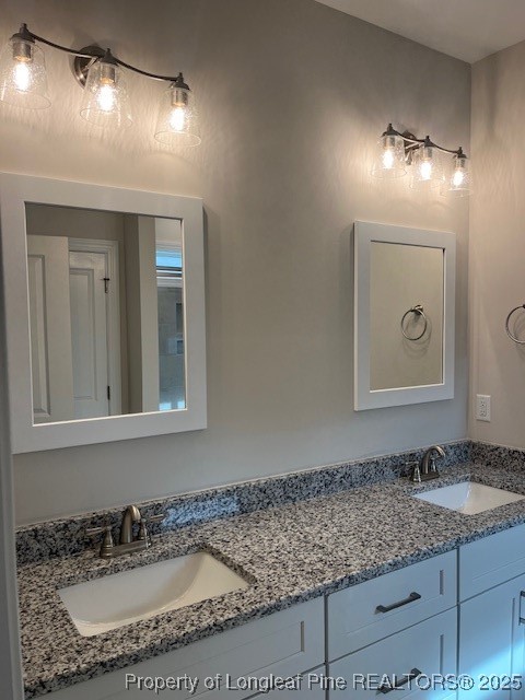112 Surles Road Benson, NC 27504 - Photo 16 of 40 a bathroom with a granite countertop sink and a mirror