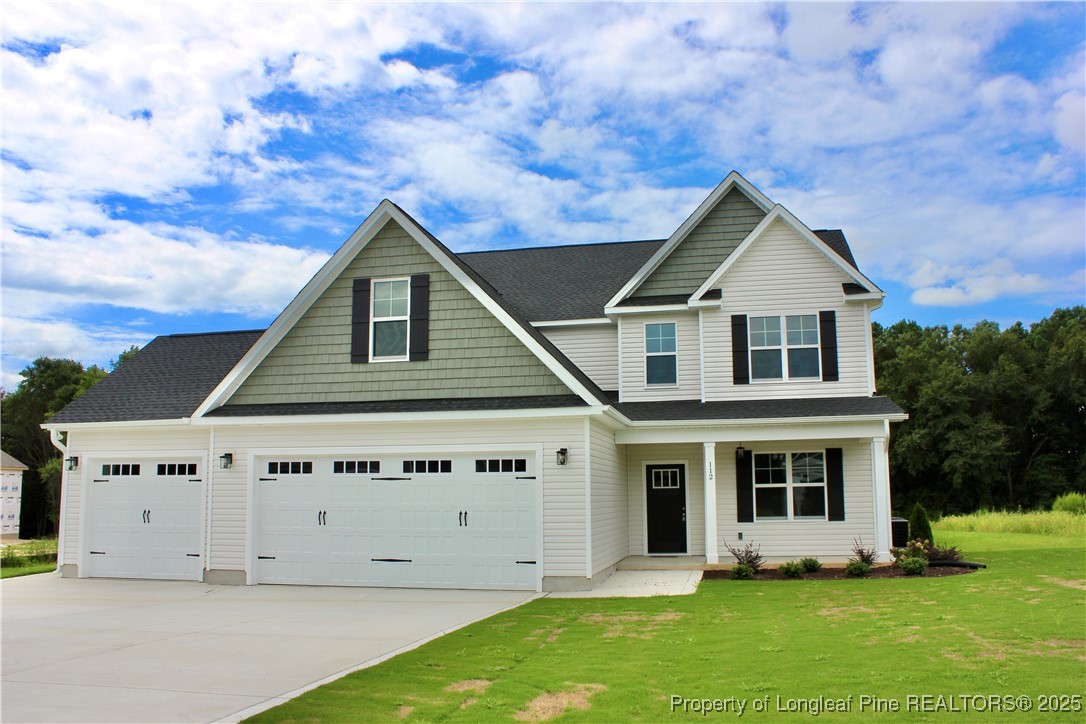 112 Surles Road Benson, NC 27504 - Photo 2 of 40 a front view of a house with garden
