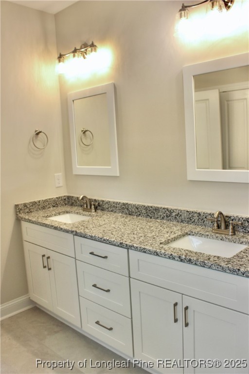 112 Surles Road Benson, NC 27504 - Photo 21 of 40 a bathroom with a granite countertop sink and a mirror