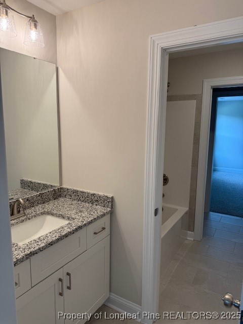 112 Surles Road Benson, NC 27504 - Photo 30 of 40 a bathroom with a granite countertop sink and a mirror