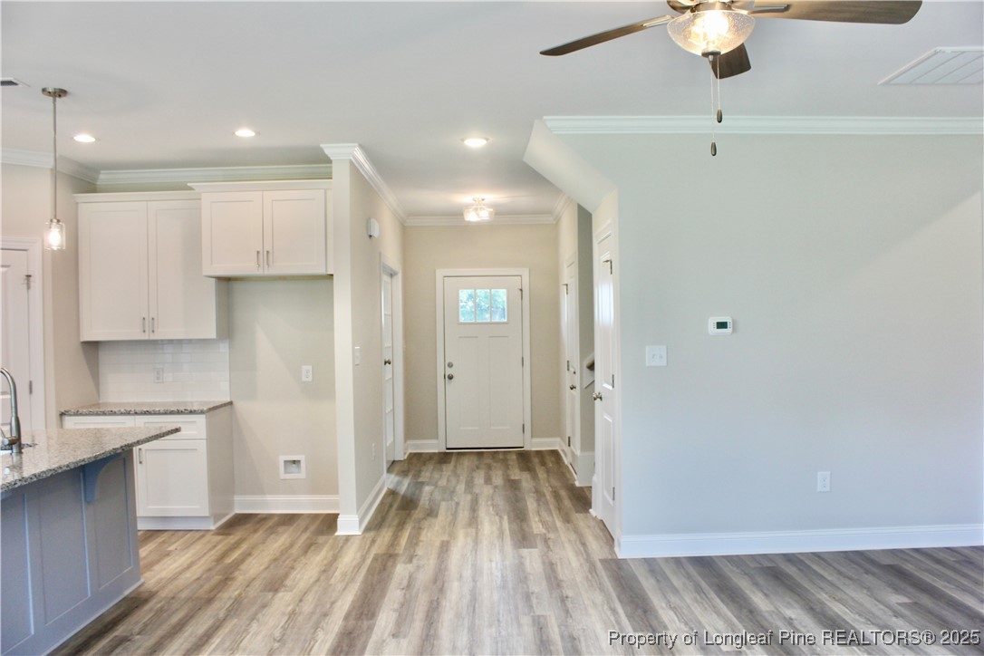 112 Surles Road Benson, NC 27504 - Photo 9 of 40 a view of a kitchen with a sink and dishwasher refrigerator freezer