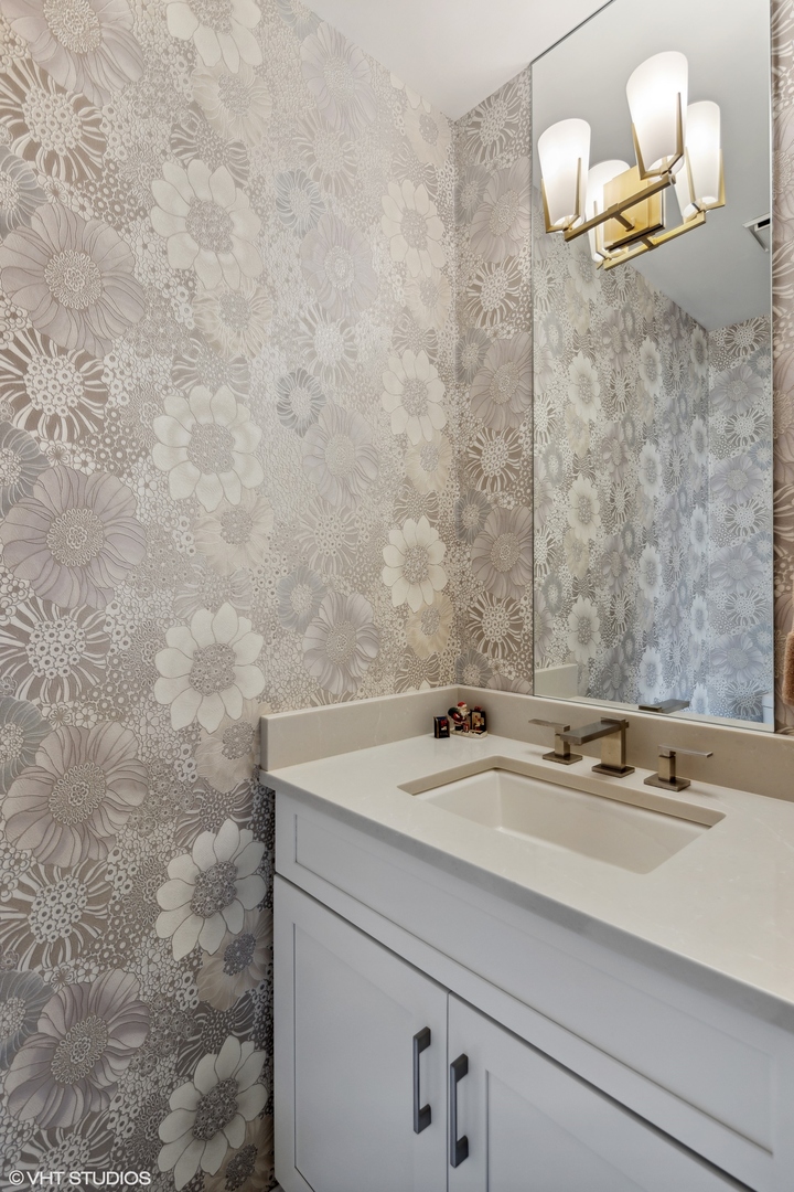 3305 North Racine Avenue, Unit E Chicago, IL 60657 - Photo 13 of 30 a bathroom with a sink and a mirror