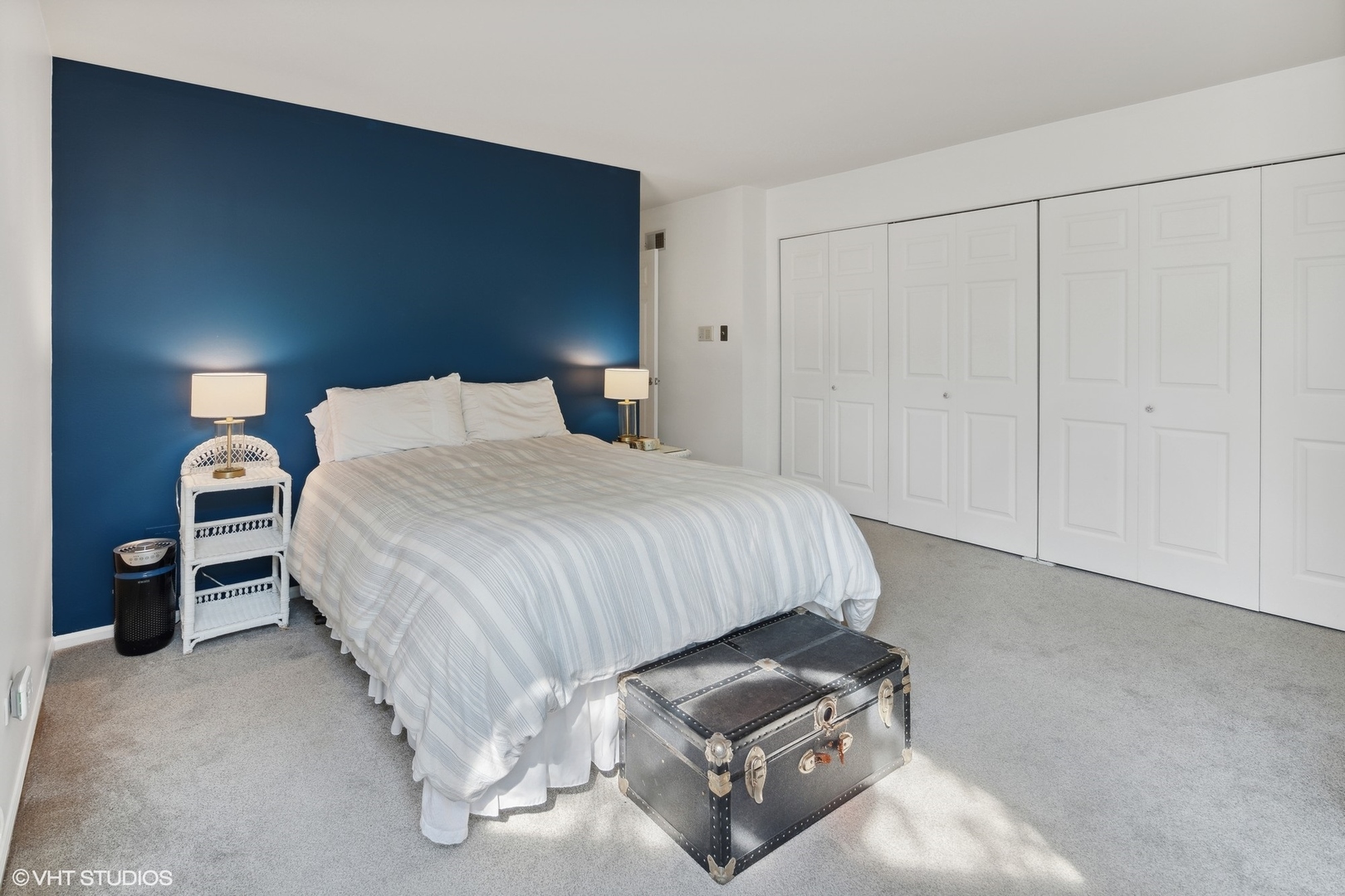 3305 North Racine Avenue, Unit E Chicago, IL 60657 - Photo 15 of 30 a bedroom with bed and a night stand