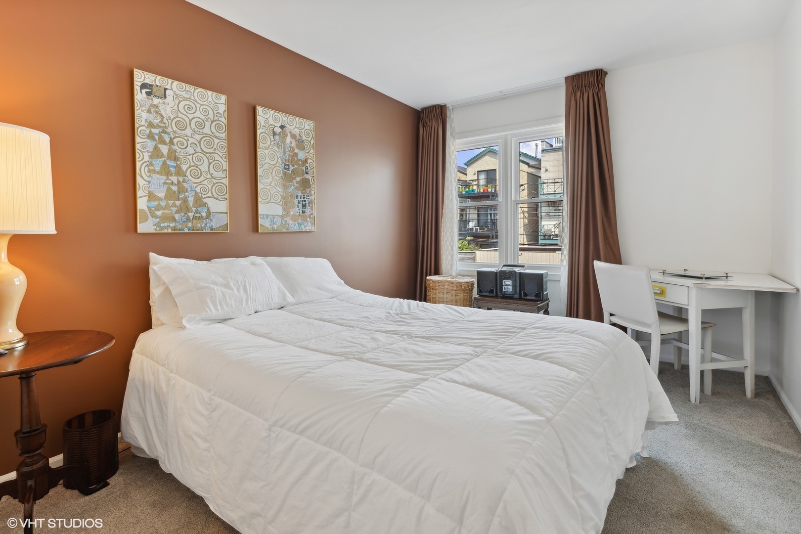 3305 North Racine Avenue, Unit E Chicago, IL 60657 - Photo 19 of 30 a large bed sitting in a bedroom next to a window