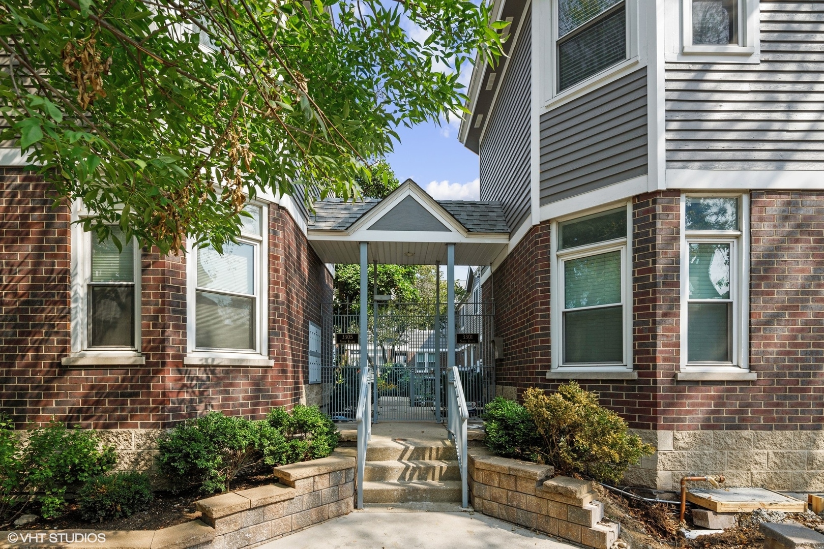 3305 North Racine Avenue, Unit E Chicago, IL 60657 - Photo 2 of 30 a front view of a house with garden