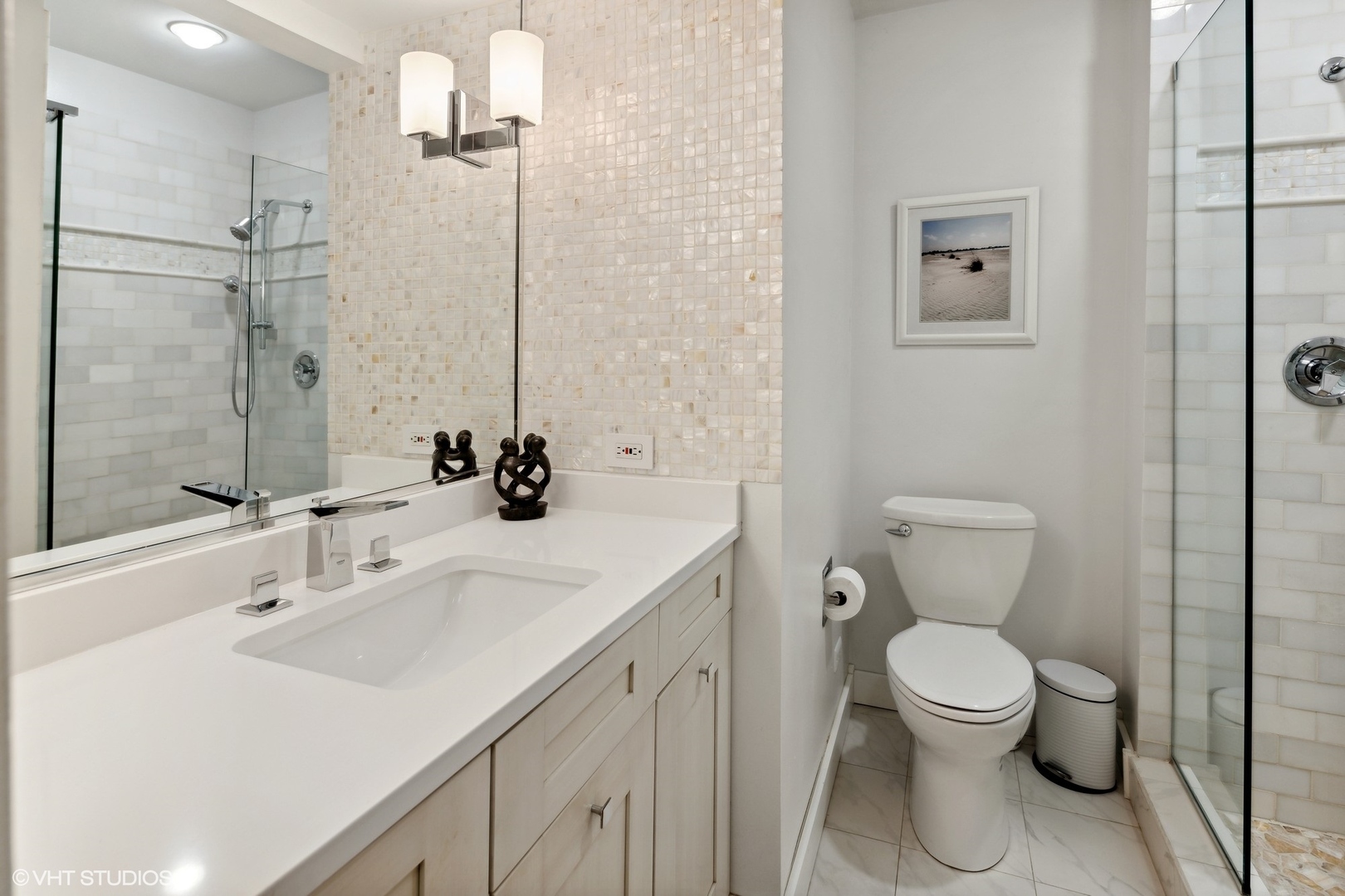 3305 North Racine Avenue, Unit E Chicago, IL 60657 - Photo 21 of 30 a bathroom with a sink a toilet and shower