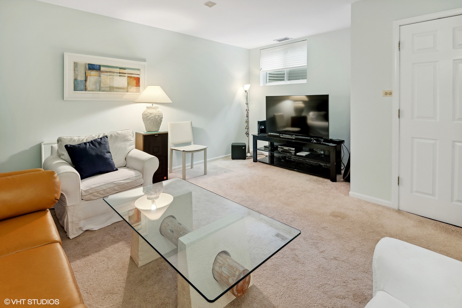 3305 North Racine Avenue, Unit E Chicago, IL 60657 - Photo 23 of 30 a living room with furniture and a flat screen tv