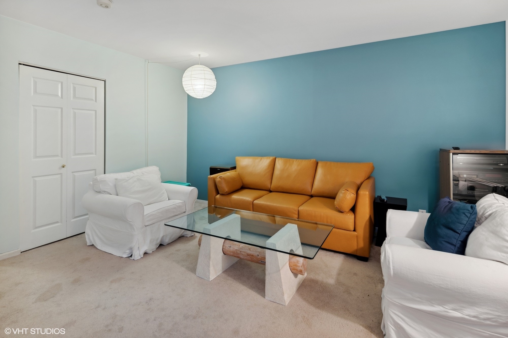 3305 North Racine Avenue, Unit E Chicago, IL 60657 - Photo 24 of 30 a living room with furniture and a lamp