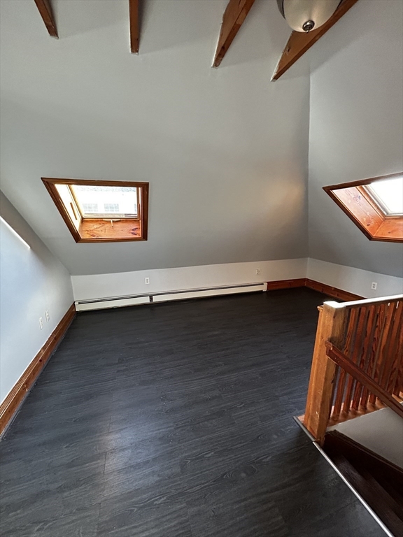 19 Roslyn Street, Unit 2 Salem, MA 01970 - Photo 16 of 17 a view of an empty room with wooden floor and a window