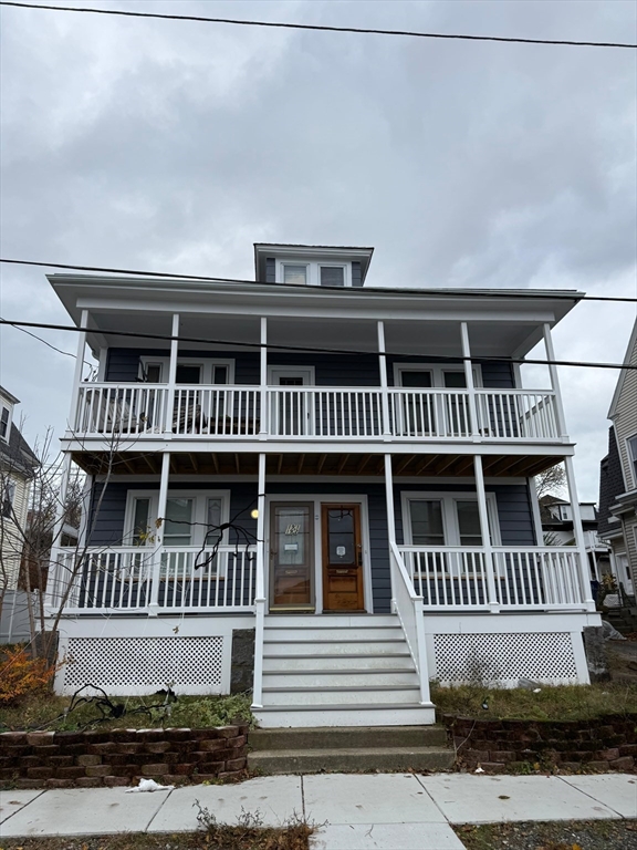 19 Roslyn Street, Unit 2 Salem, MA 01970 - Photo 2 of 17 front view of a house with a deck