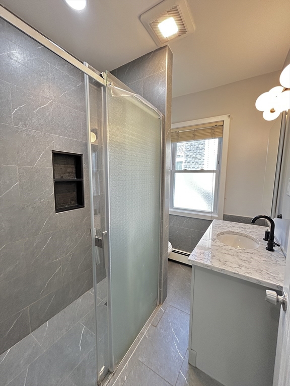 19 Roslyn Street, Unit 2 Salem, MA 01970 - Photo 3 of 17 a bathroom with a shower and a sink