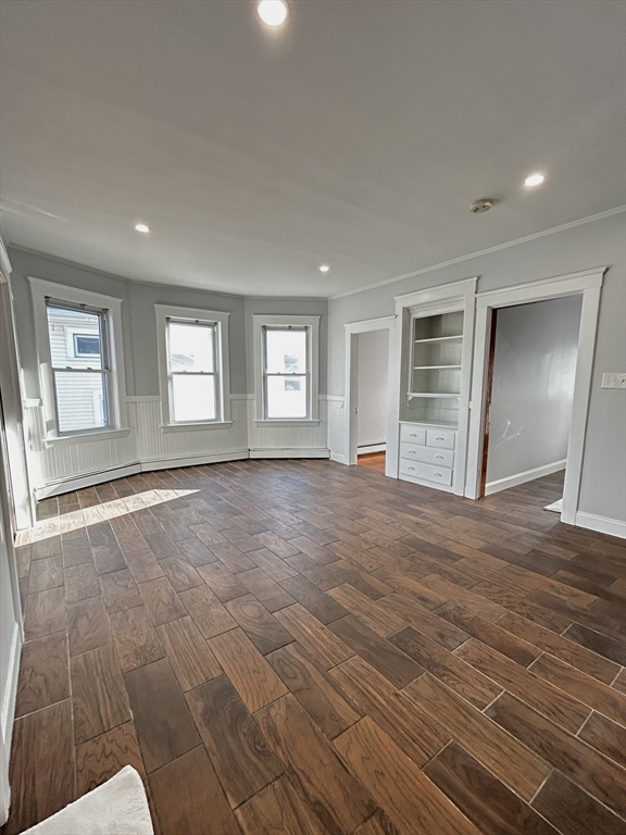 19 Roslyn Street, Unit 2 Salem, MA 01970 - Photo 6 of 17 a view of empty room with wooden floor and fan
