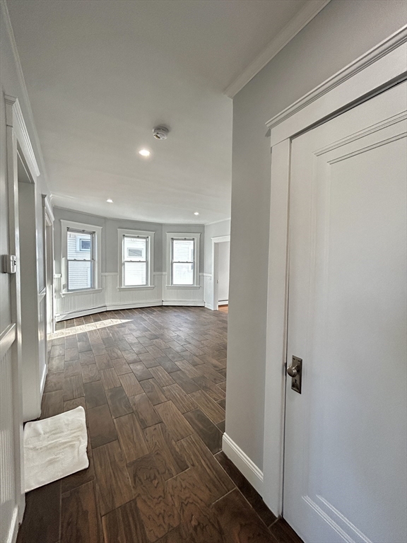 19 Roslyn Street, Unit 2 Salem, MA 01970 - Photo 7 of 17 a view of livingroom with hardwood floor and window