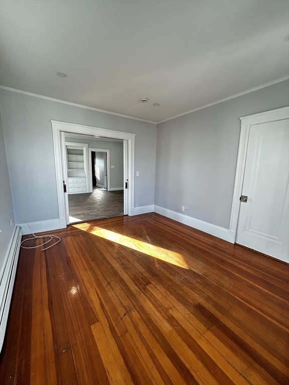 19 Roslyn Street, Unit 2 Salem, MA 01970 - Photo 8 of 17 a view of empty room with wooden floor