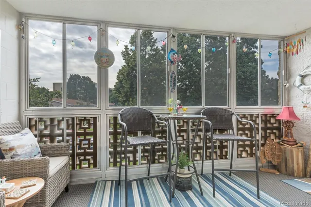 a large bedroom with a bed and a flat screen tv