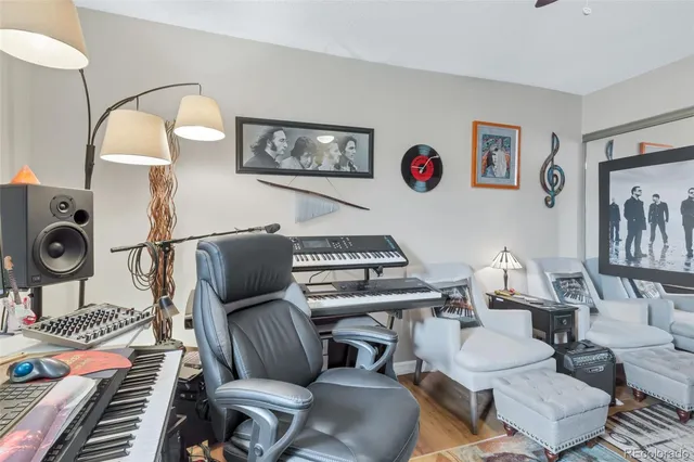 a white toilet sitting next to a bathroom sink and vanity