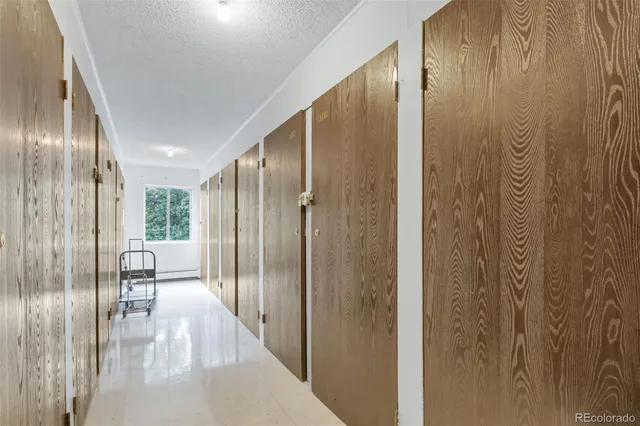 front view of a house with a yard and potted plants