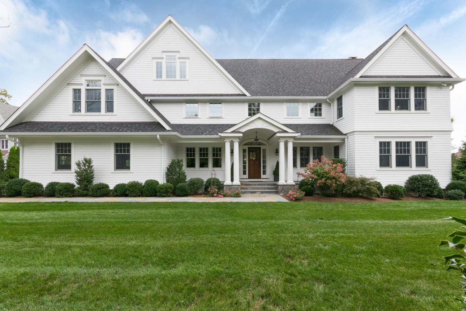 174 Middlesex Road Darien, CT 06820 - Photo 1 of 48 a front view of a house with a yard