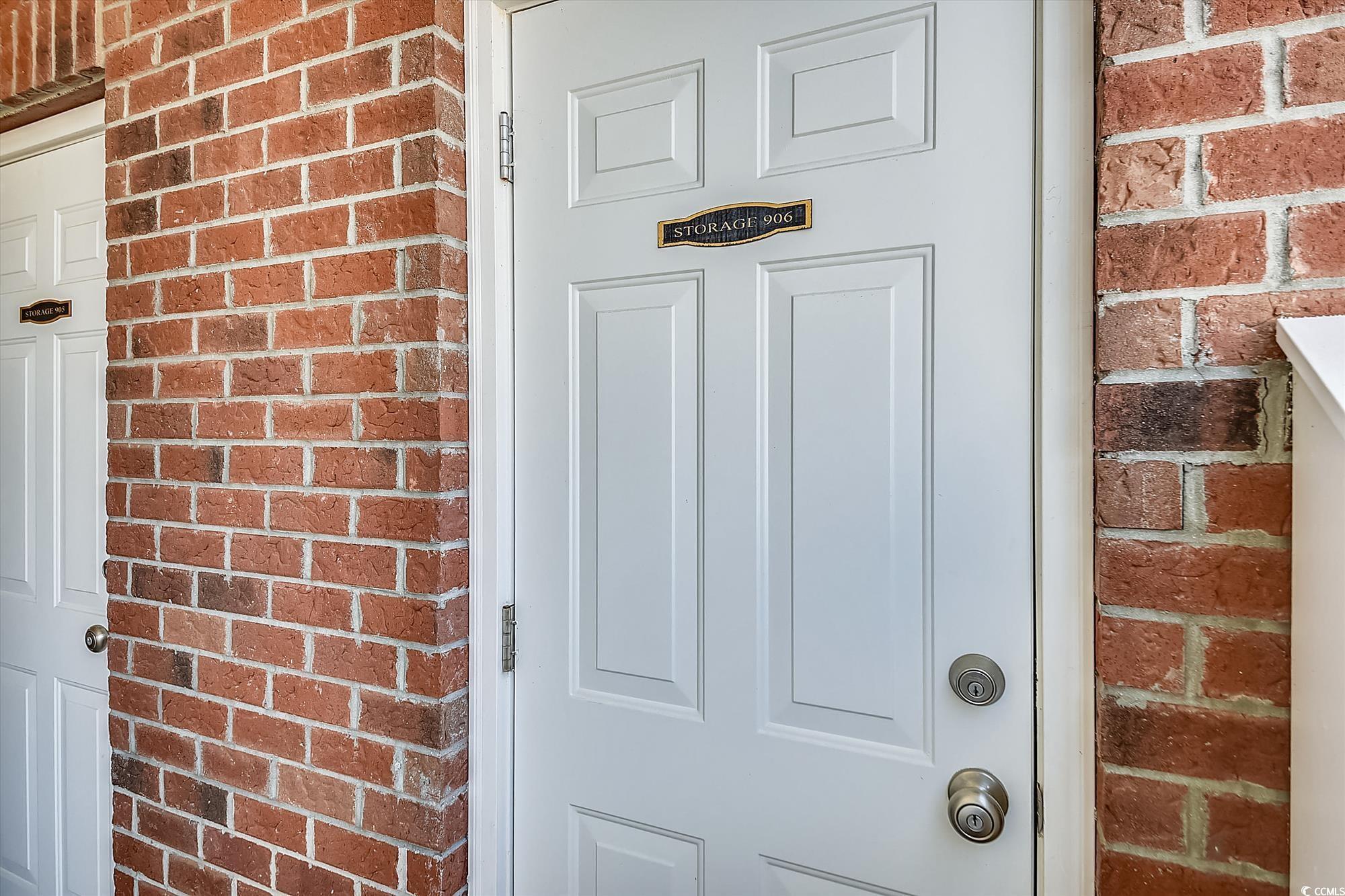 1029 Ray Costin Way, Unit VILLA 906 Murrells Inlet, SC 29576 - Photo 31 of 40 Doorway to property featuring brick siding