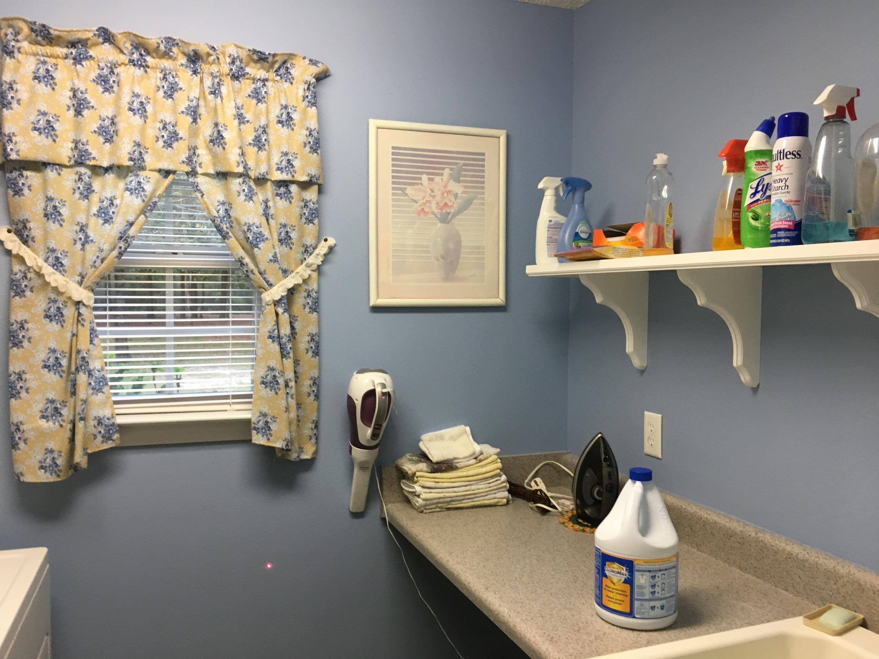 6135 Holloway Road Baker, FL 32531 - Photo 18 of 23 a room with a window and flowerpot