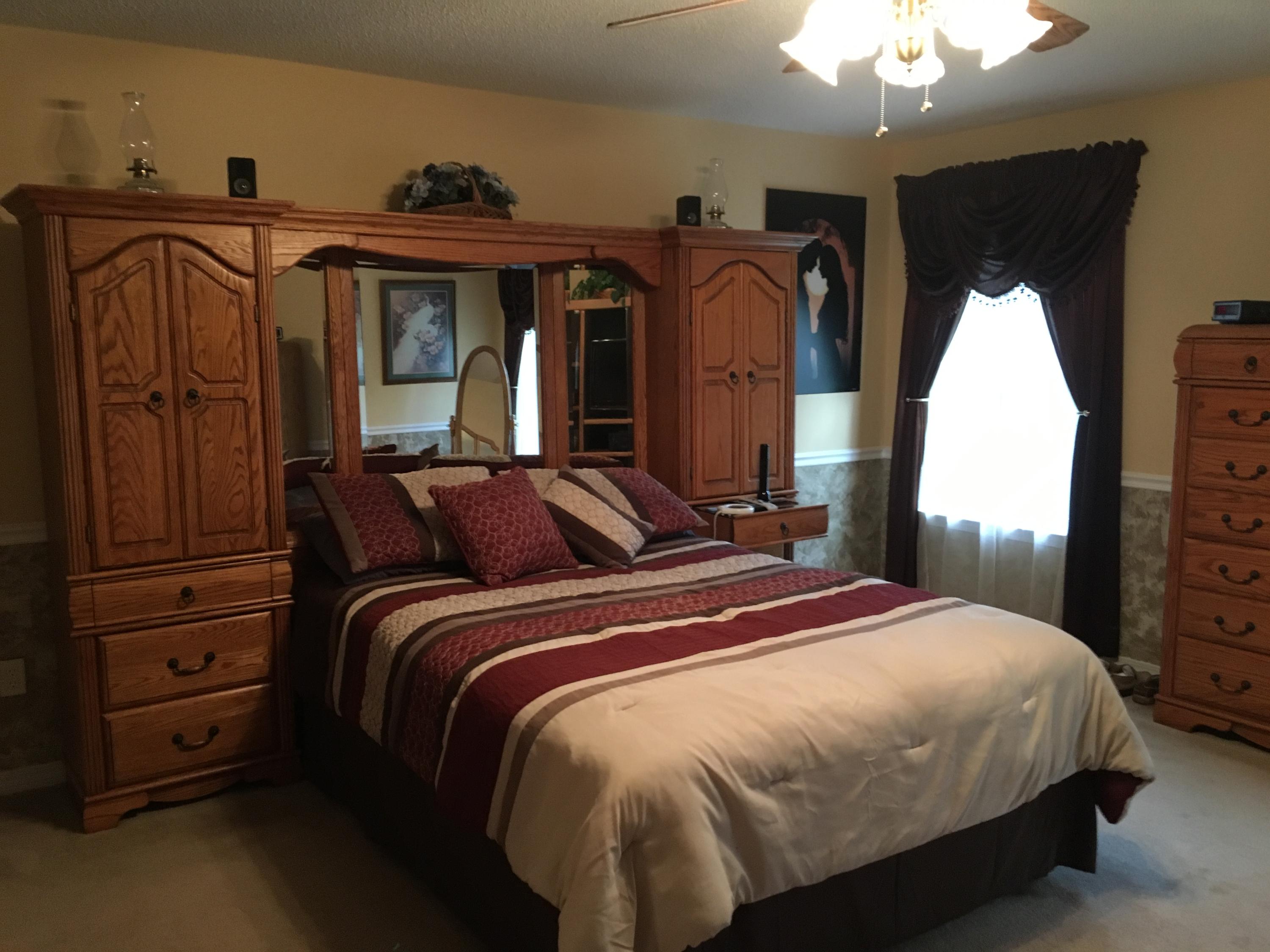 6135 Holloway Road Baker, FL 32531 - Photo 20 of 23 a bedroom with bed and wooden floor
