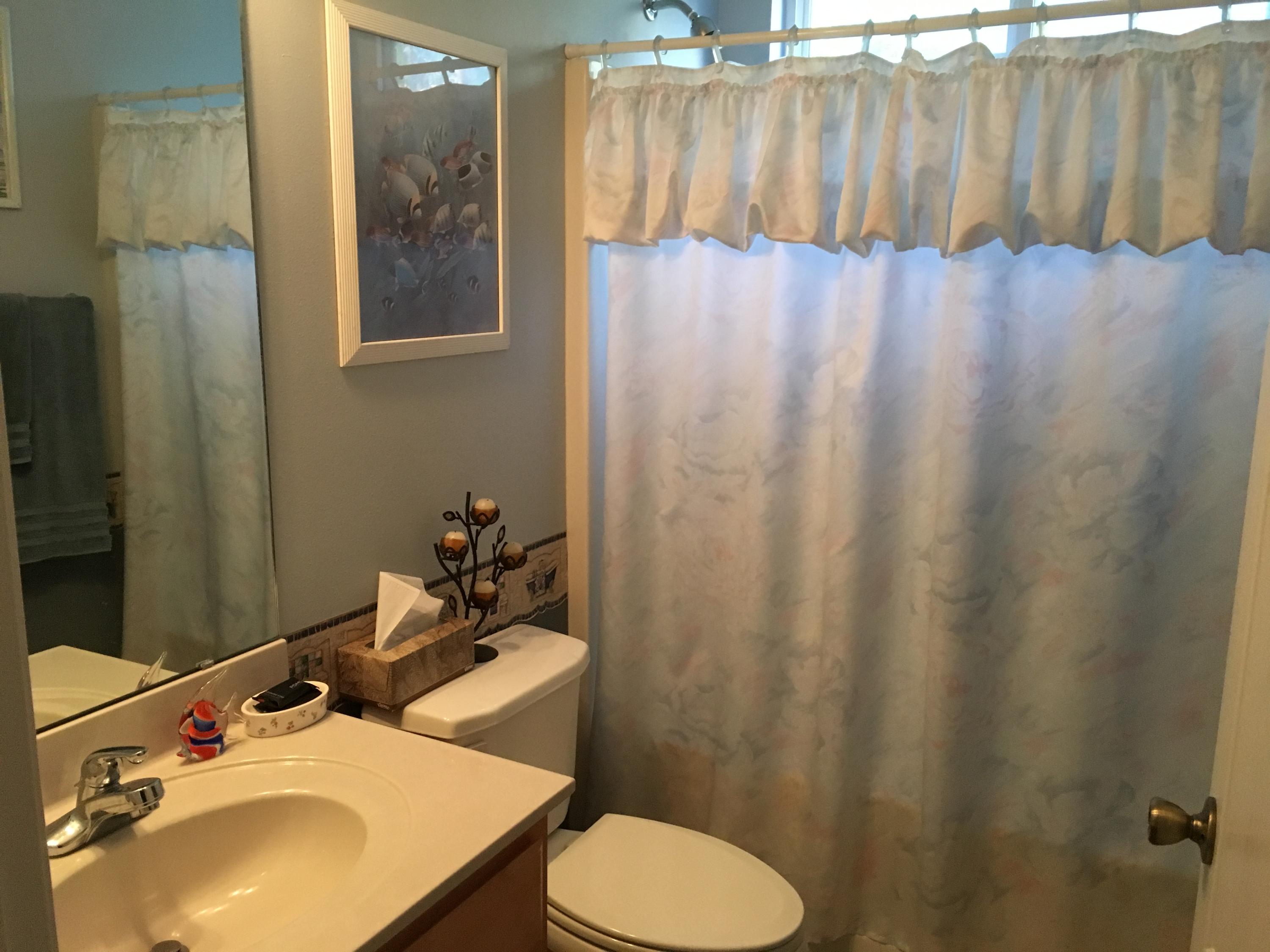 6135 Holloway Road Baker, FL 32531 - Photo 21 of 23 a bathroom with a sink toilet and mirror