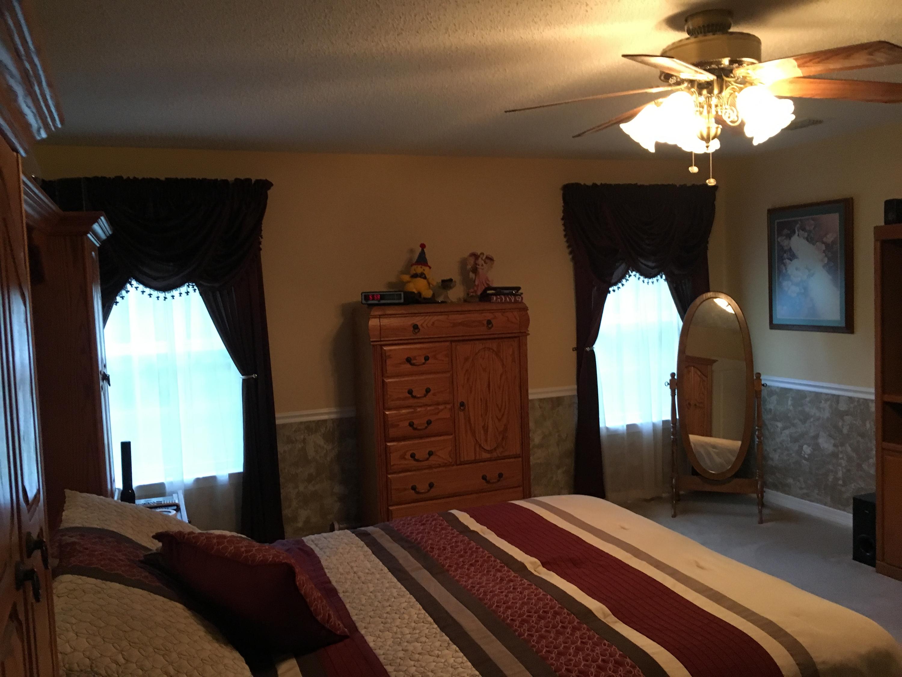 6135 Holloway Road Baker, FL 32531 - Photo 23 of 23 a bedroom with a bed dresser and a window