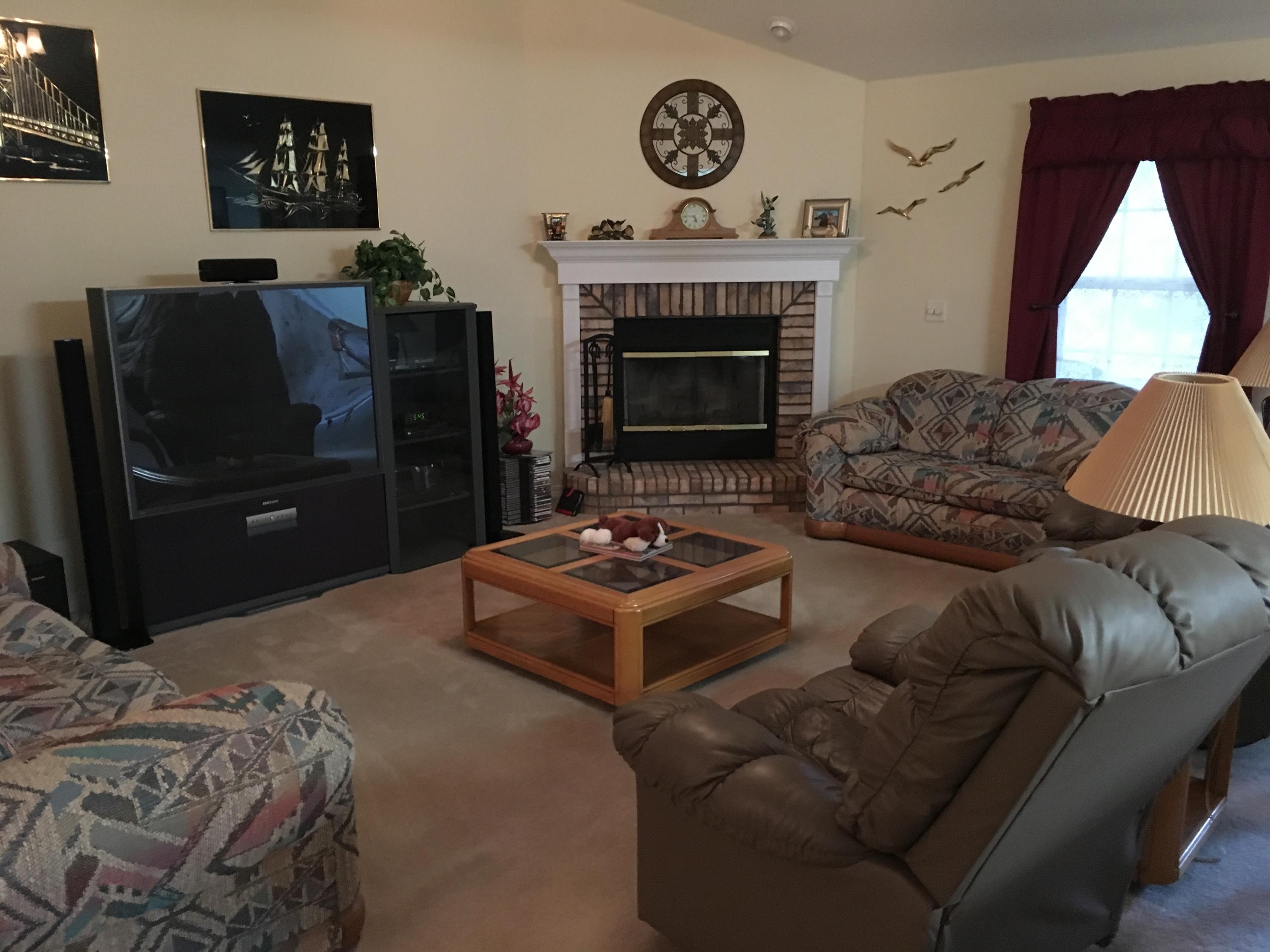 6135 Holloway Road Baker, FL 32531 - Photo 8 of 23 a living room with furniture and a fireplace