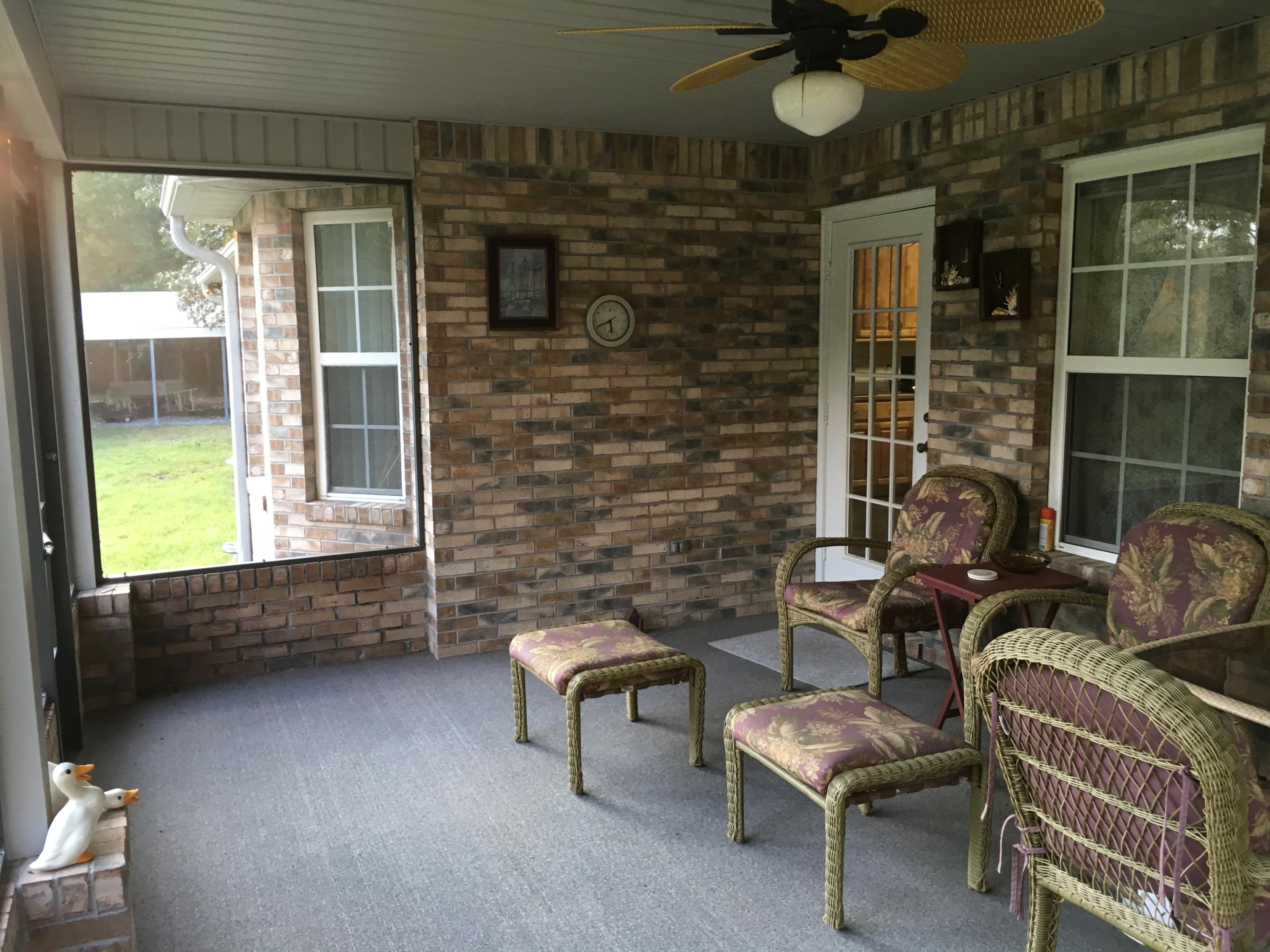 6135 Holloway Road Baker, FL 32531 - Photo 9 of 23 a balcony with furniture and a potted plant