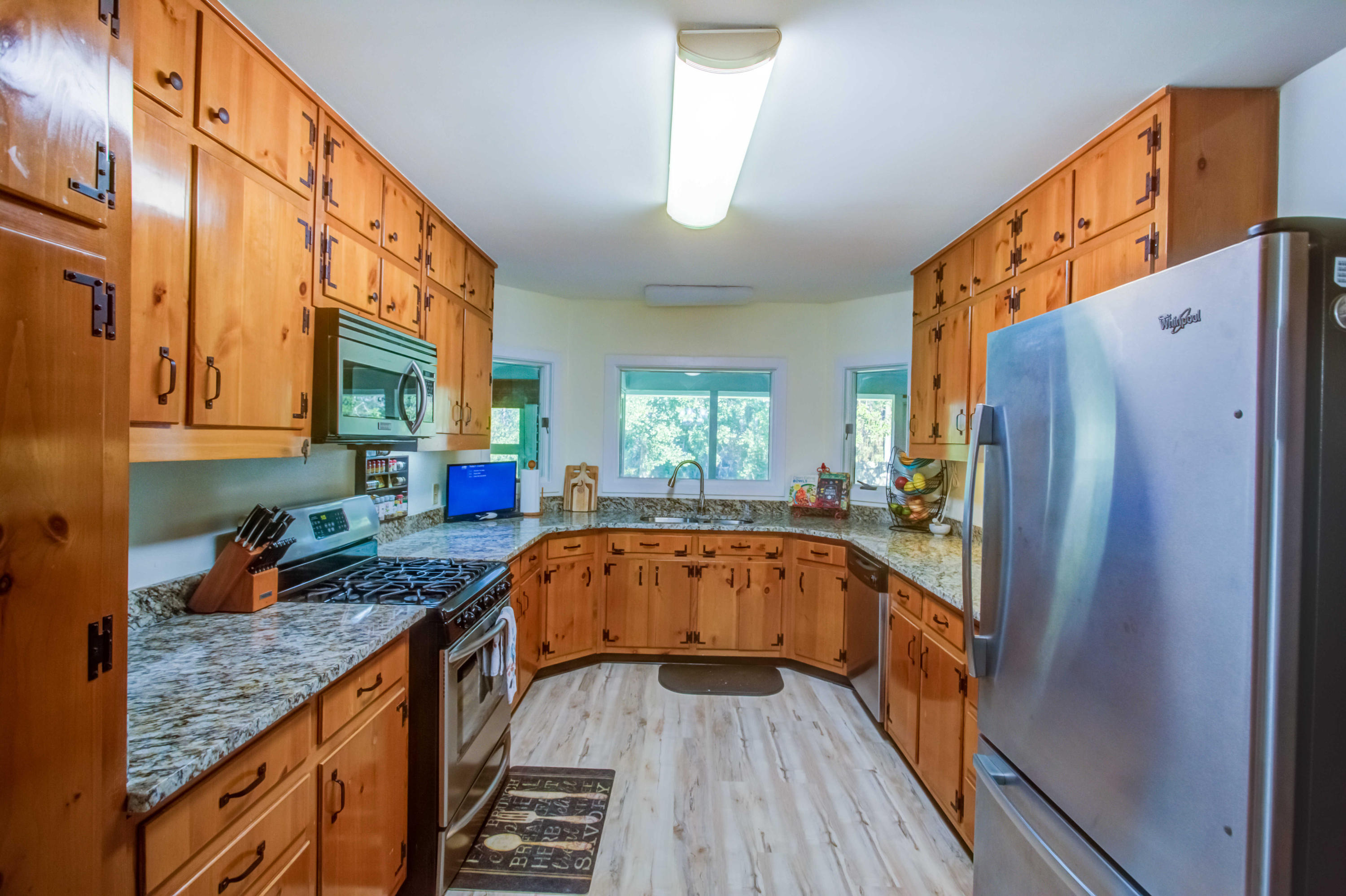 6116 Pine Ridge Lane Crestview, FL 32539 - Photo 15 of 45 a kitchen with stainless steel appliances granite countertop a refrigerator and a sink
