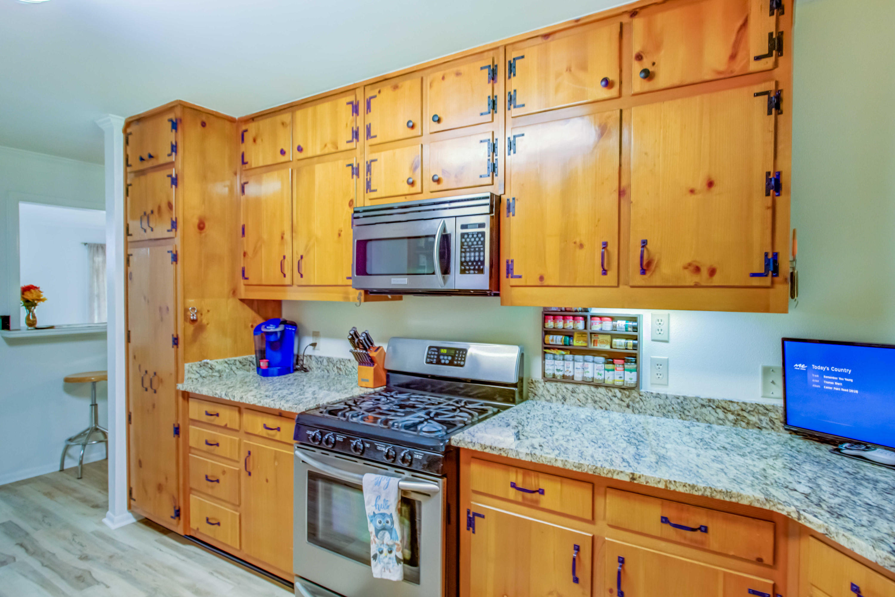 6116 Pine Ridge Lane Crestview, FL 32539 - Photo 17 of 45 a kitchen with stainless steel appliances granite countertop a stove a sink and a microwave