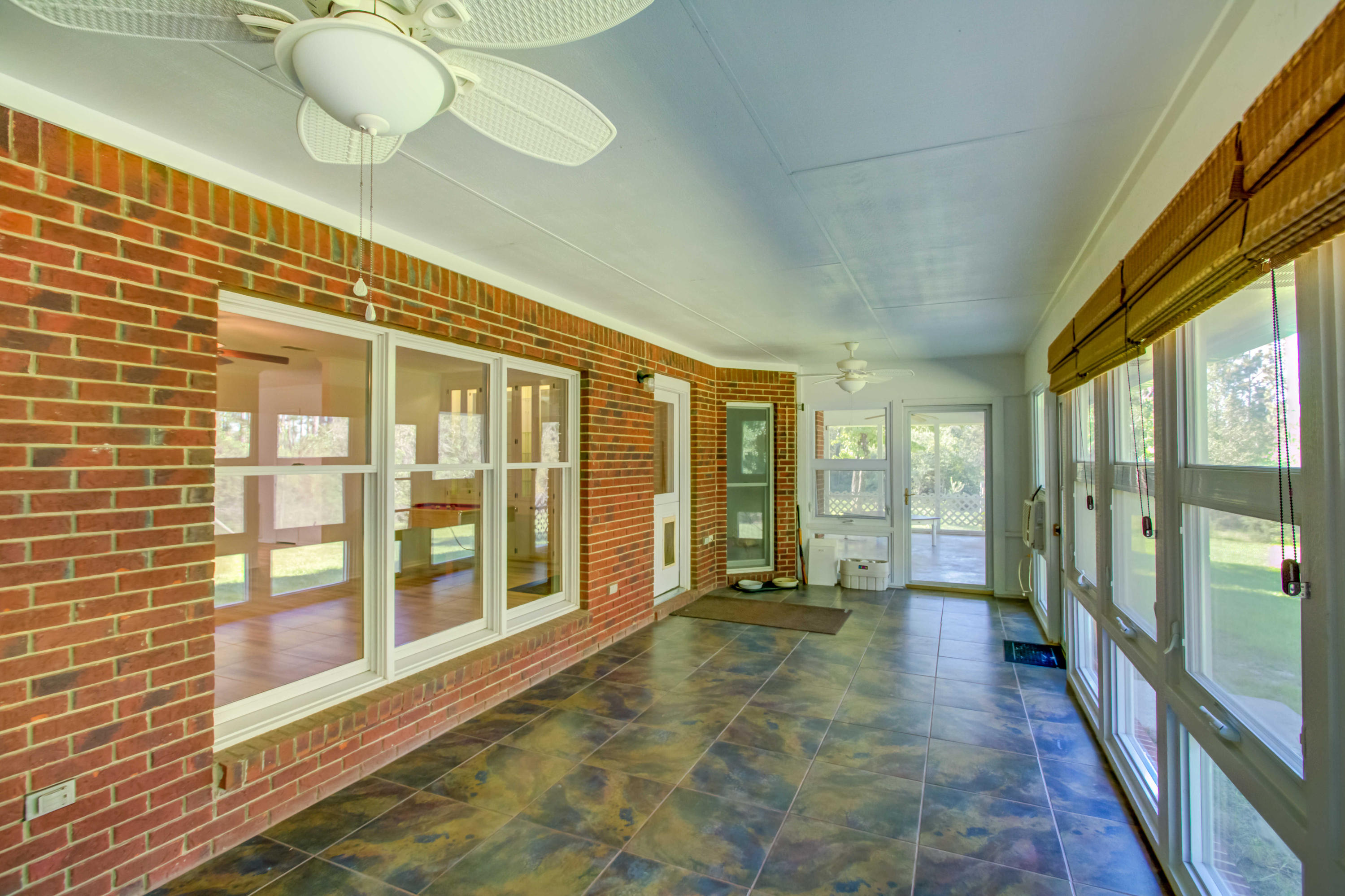 6116 Pine Ridge Lane Crestview, FL 32539 - Photo 20 of 45 a living room with a large window