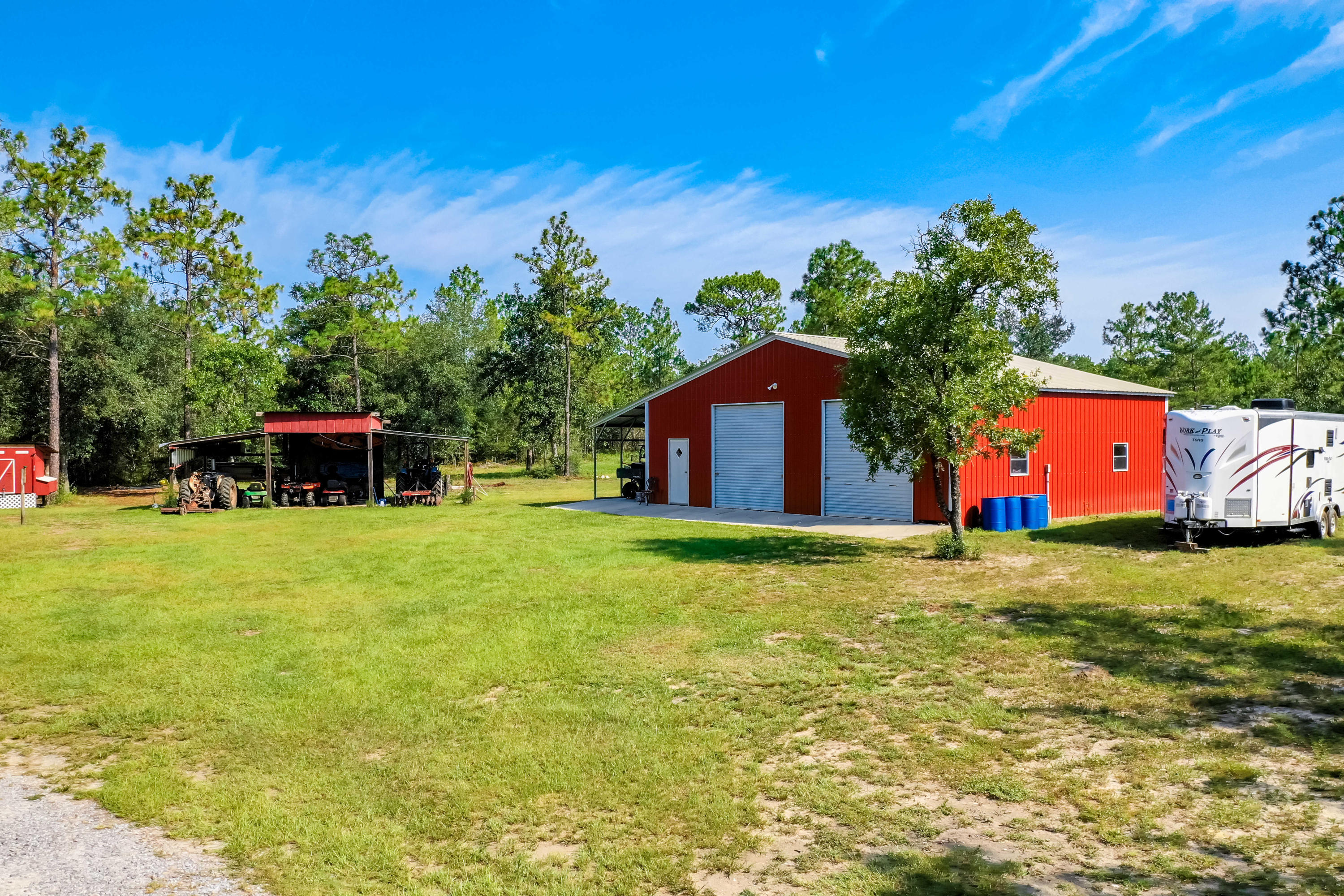 6116 Pine Ridge Lane Crestview, FL 32539 - Photo 2 of 45 a backyard of a house with table and chairs