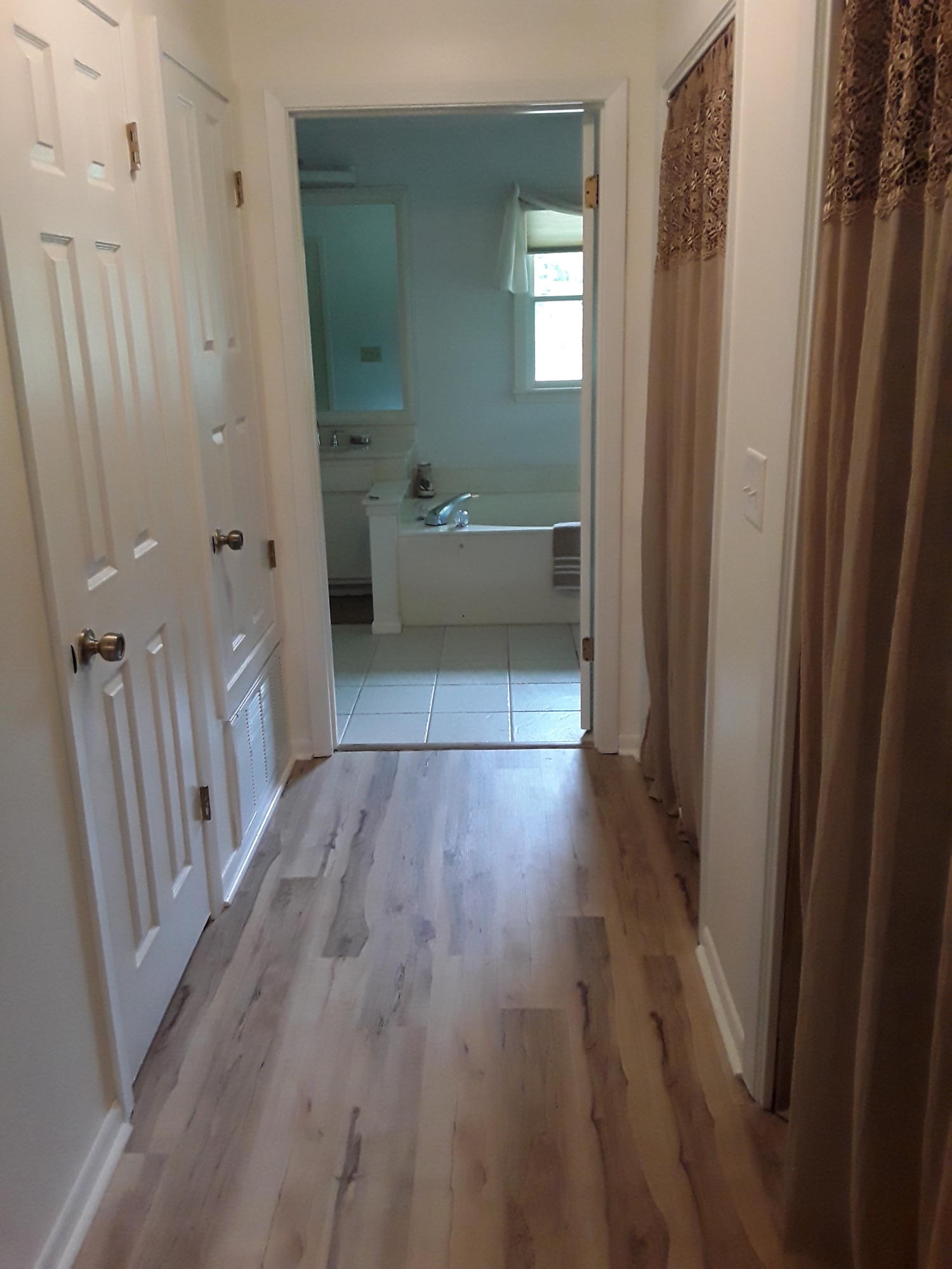 6116 Pine Ridge Lane Crestview, FL 32539 - Photo 24 of 45 a view of a bathroom from a hallway