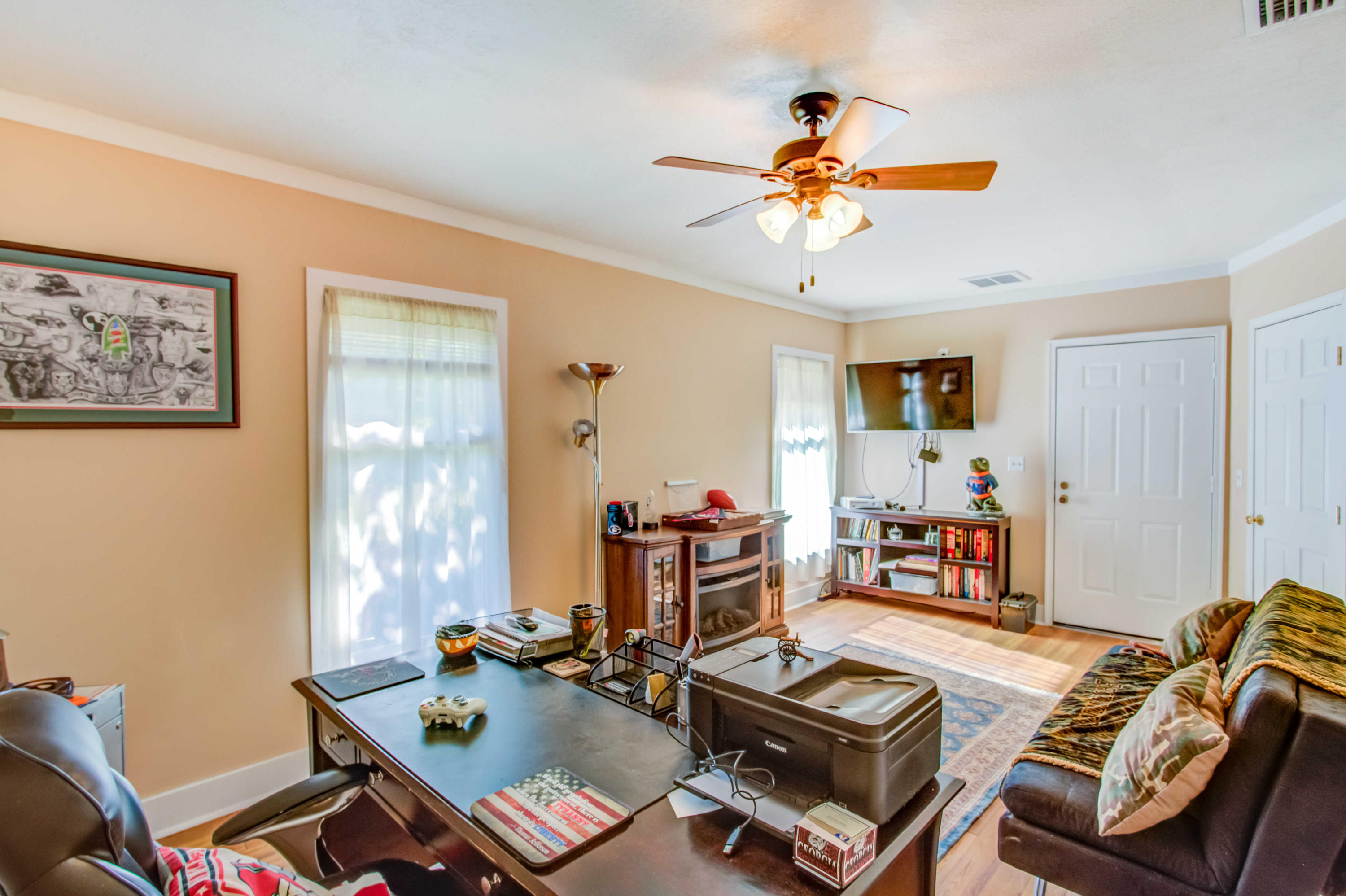6116 Pine Ridge Lane Crestview, FL 32539 - Photo 31 of 45 a room with furniture and wooden floor