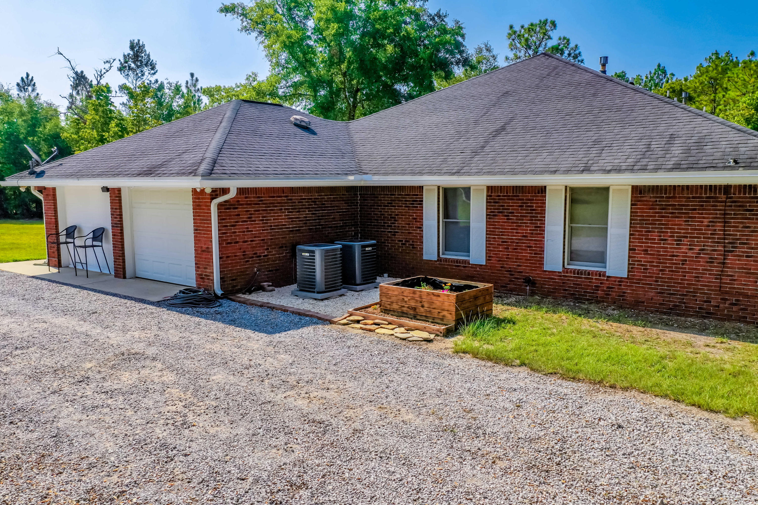 6116 Pine Ridge Lane Crestview, FL 32539 - Photo 35 of 45 a view of a house with backyard and garden