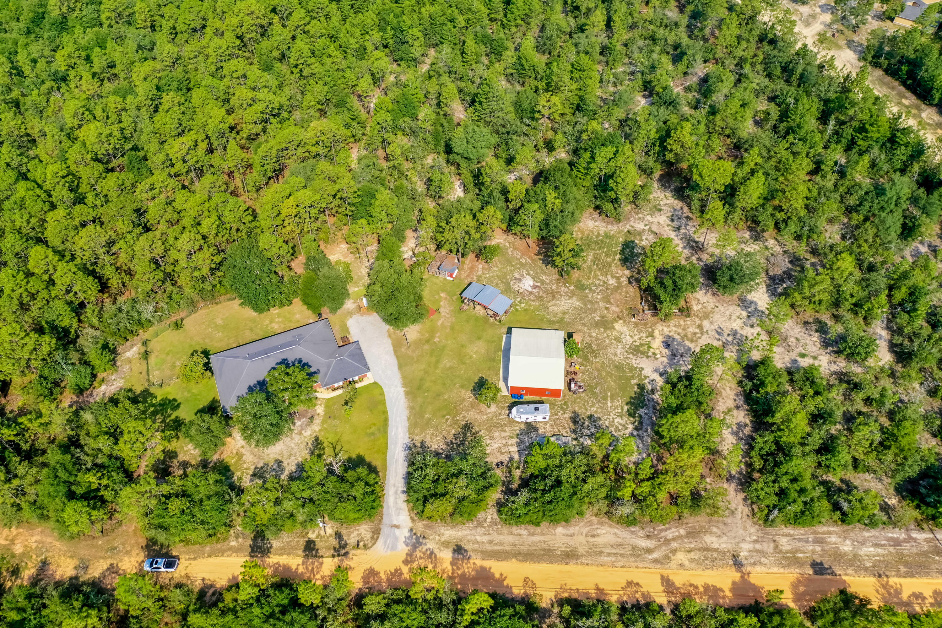 6116 Pine Ridge Lane Crestview, FL 32539 - Photo 4 of 45 a aerial view of a house with a yard and lake view