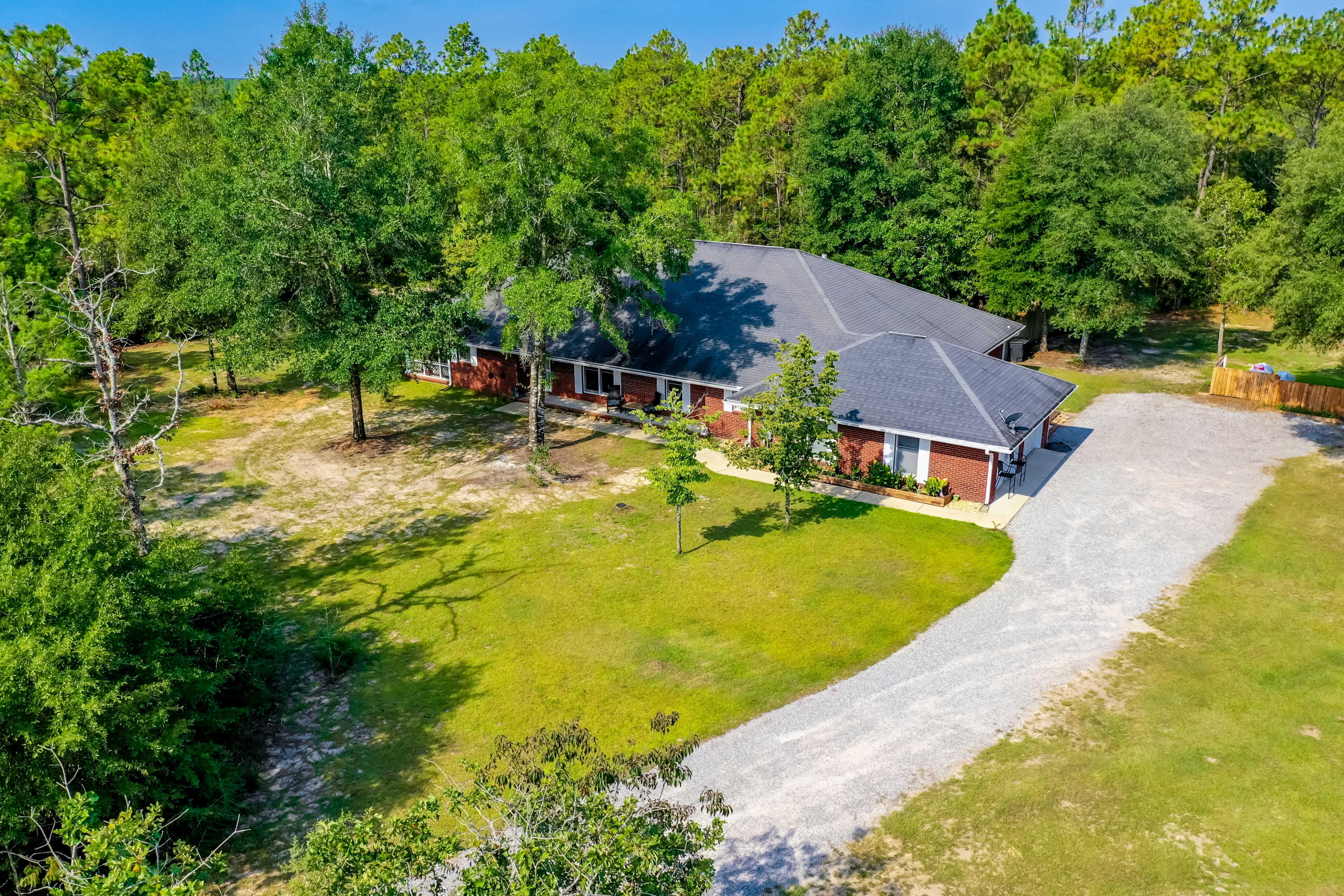 6116 Pine Ridge Lane Crestview, FL 32539 - Photo 41 of 45 an aerial view of a house with swimming pool garden and patio