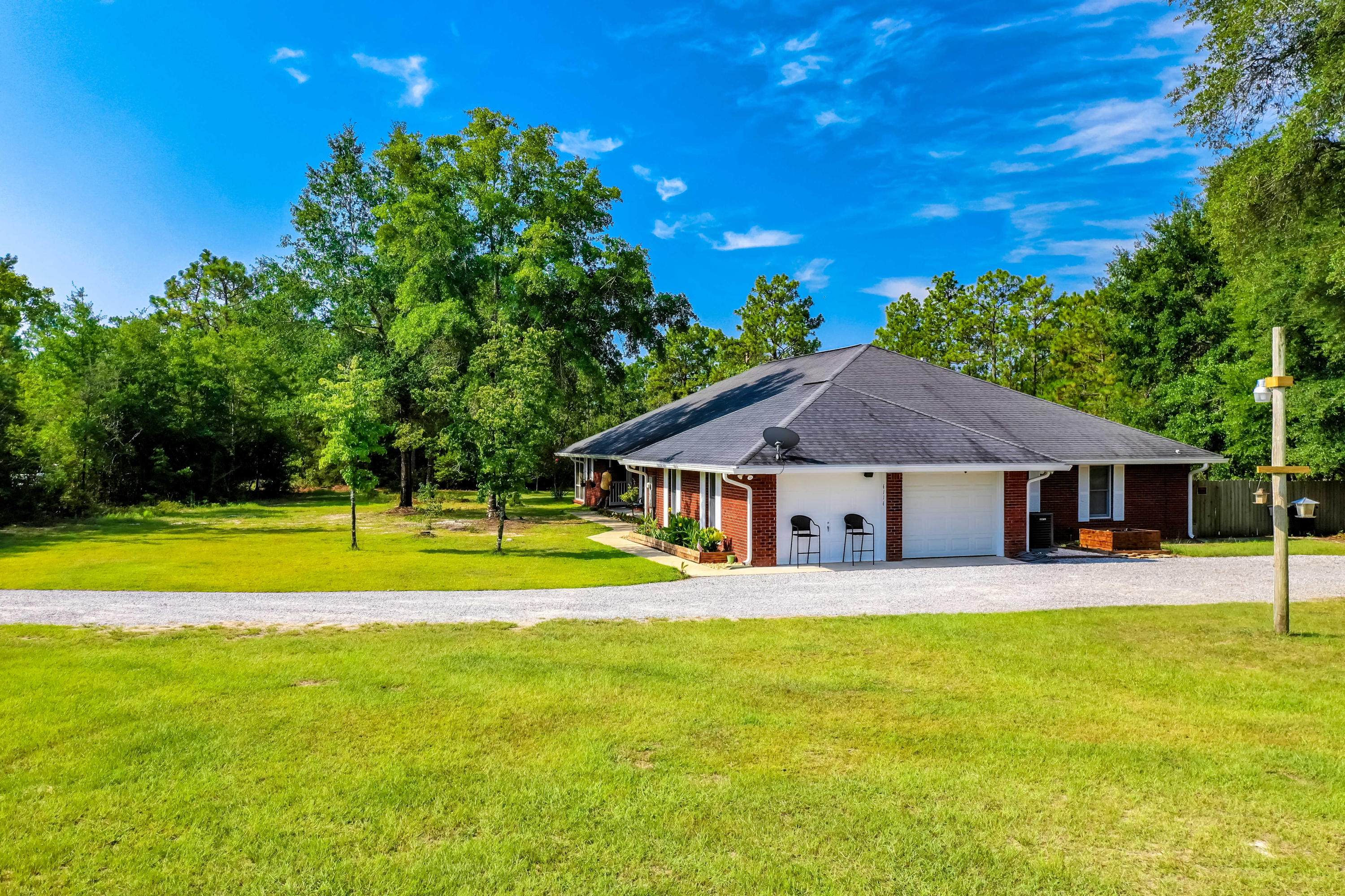 6116 Pine Ridge Lane Crestview, FL 32539 - Photo 8 of 45 a house view with swimming pool in front of it