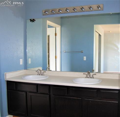 7560 Coffee Road Peyton, CO 80831 - Photo 12 of 17 Master bath with double sinks