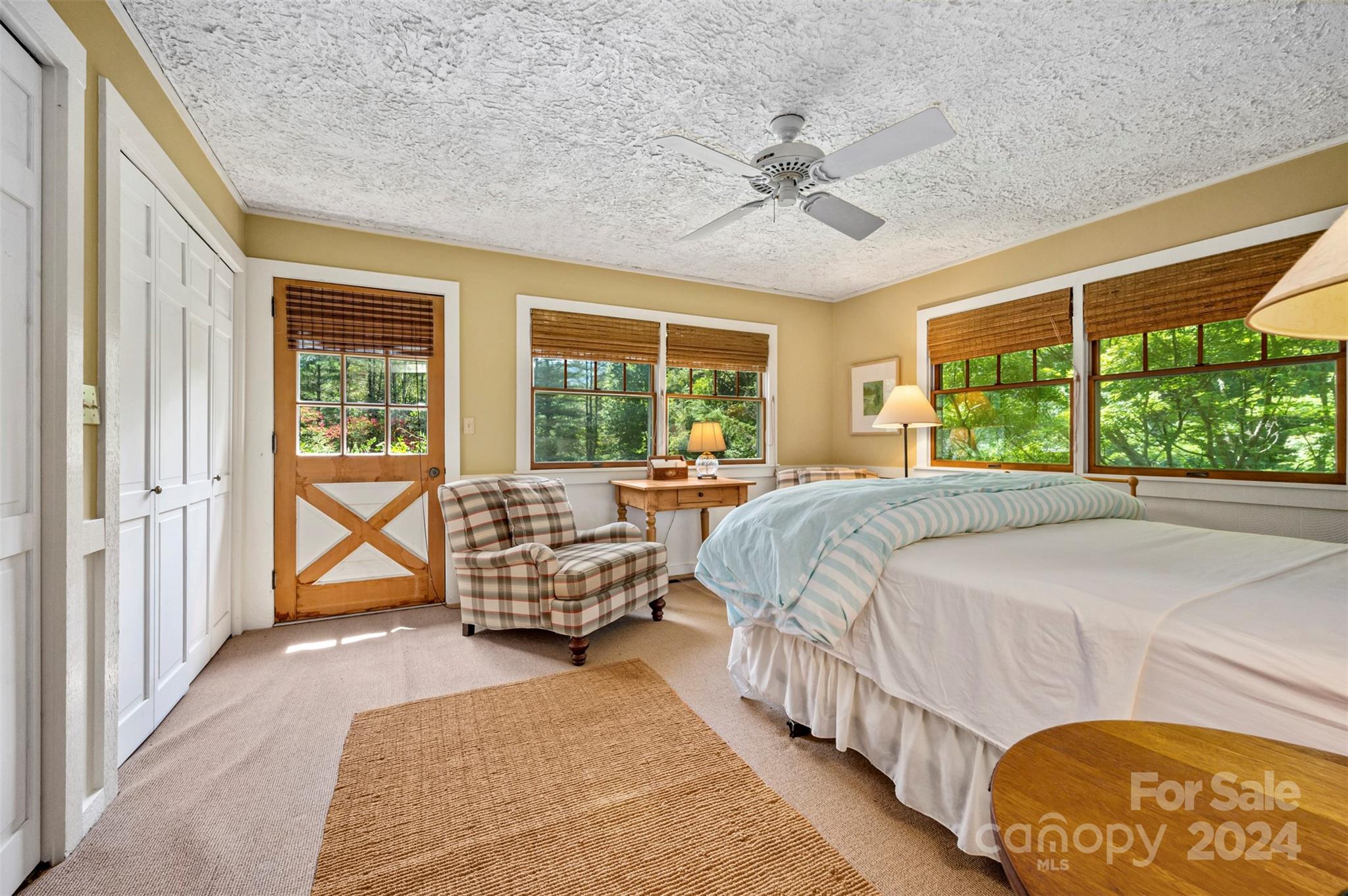 102 Dug Hill Road Landrum, SC 29356 - Photo 14 of 30 a bed sitting in a bedroom next to a window