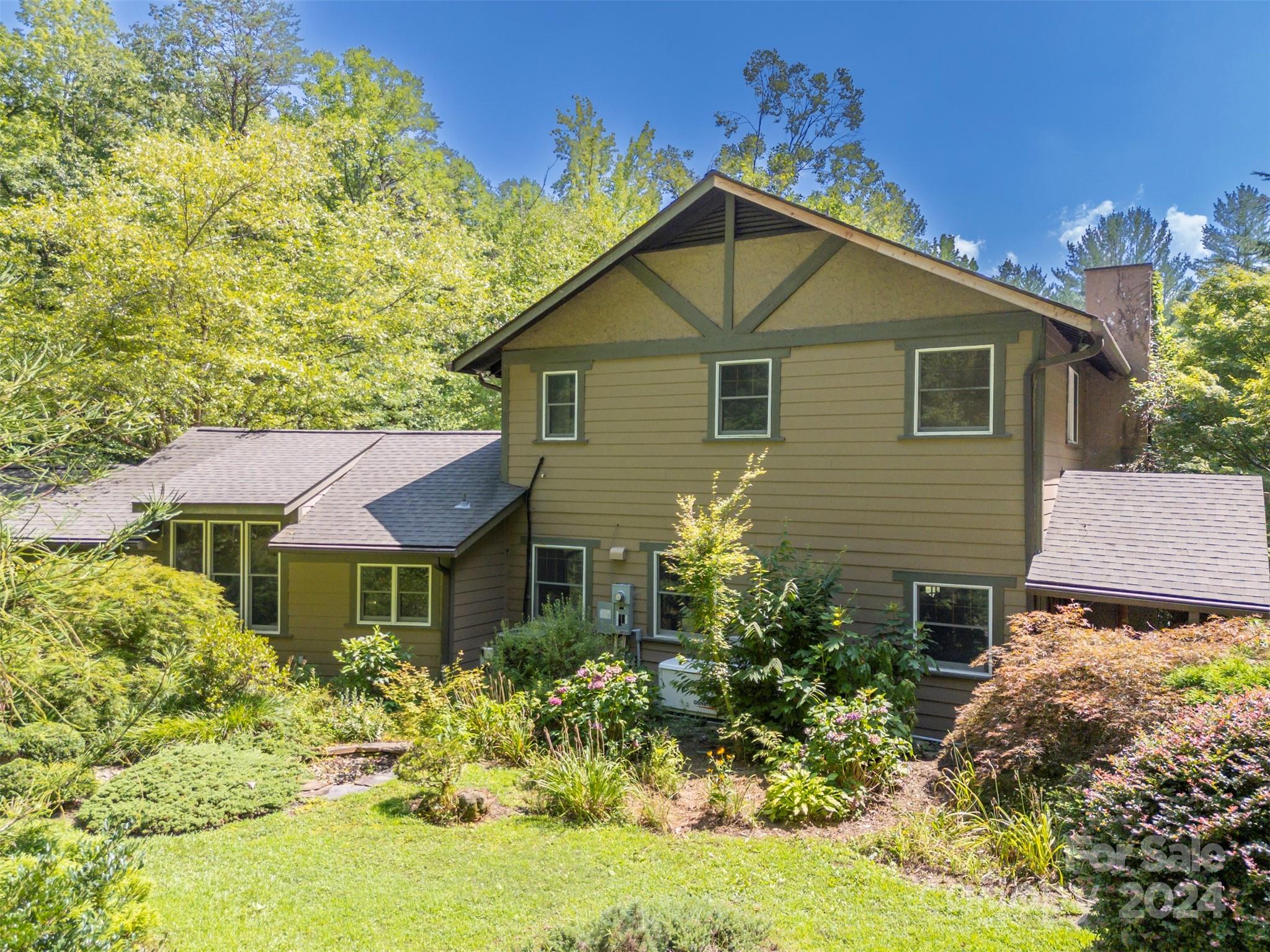 102 Dug Hill Road Landrum, SC 29356 - Photo 17 of 30 a front view of a house with a yard