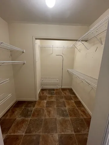 a bathroom with a glass door shower