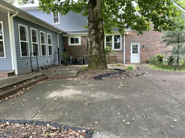 a view of a pathway with a fire pit