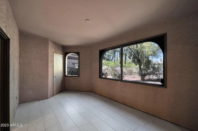 a swimming pool with outdoor seating and yard